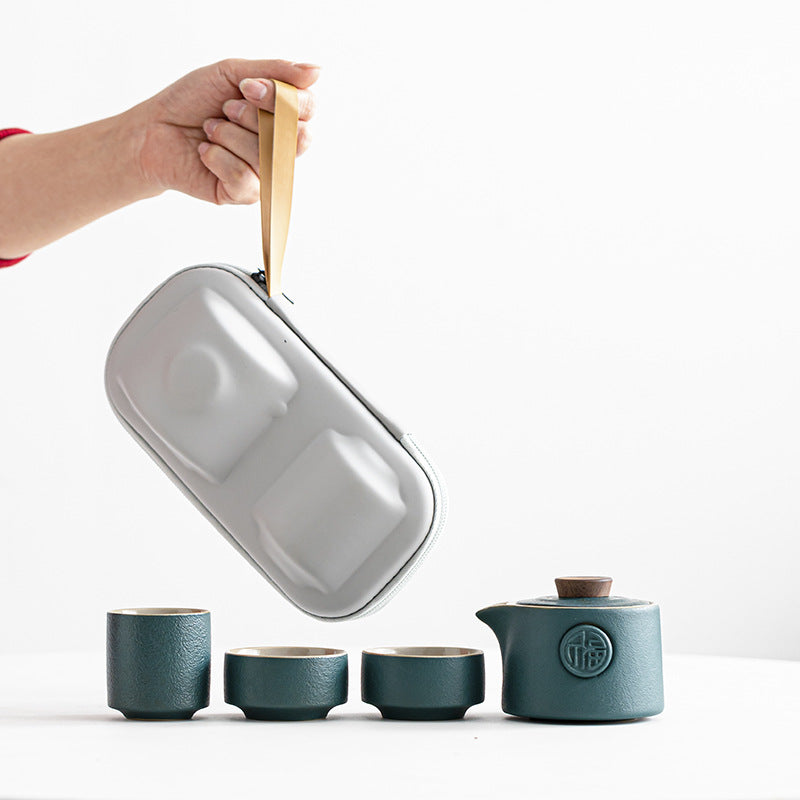 Tea set with a carrying case on a white background