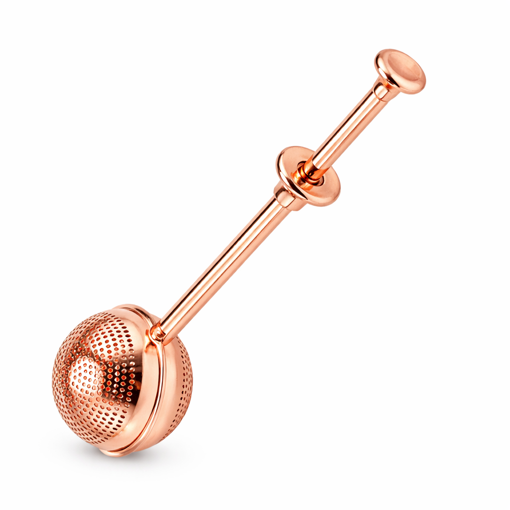 Rose gold tea infuser on a white background