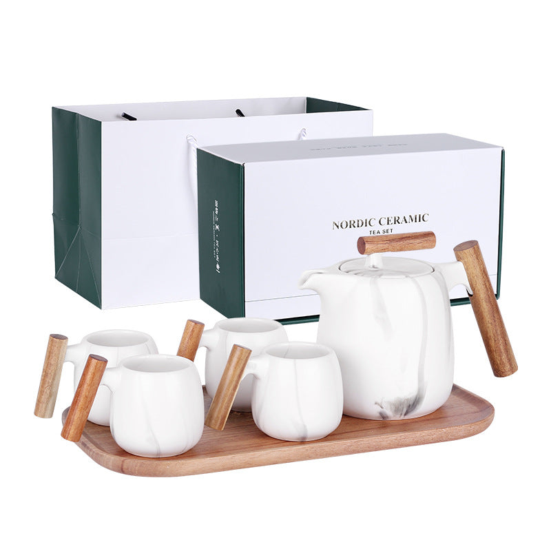 Nordic ceramic tea set with white teapot and mugs on a wooden tray, displayed against a white background.