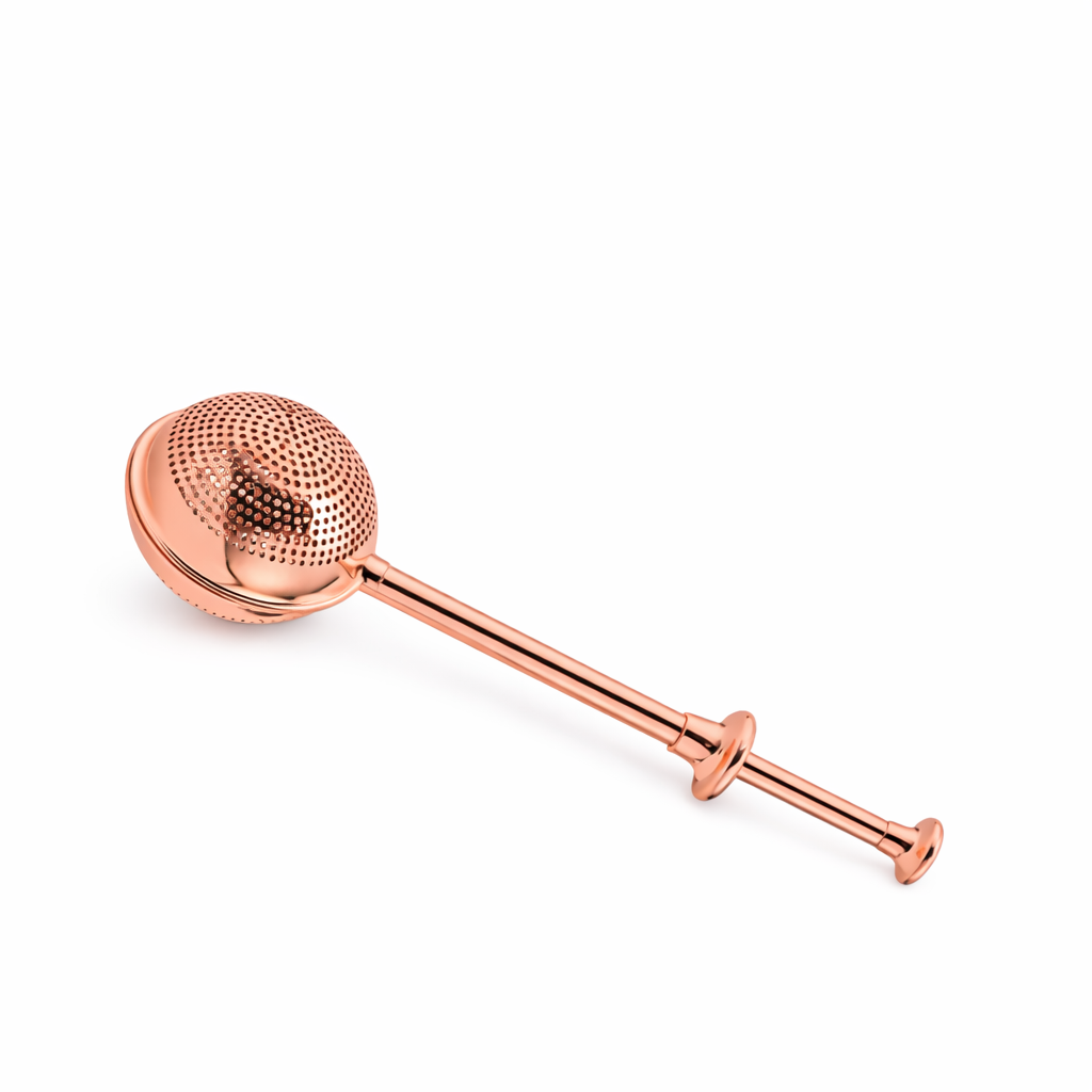Rose gold tea infuser on a white background