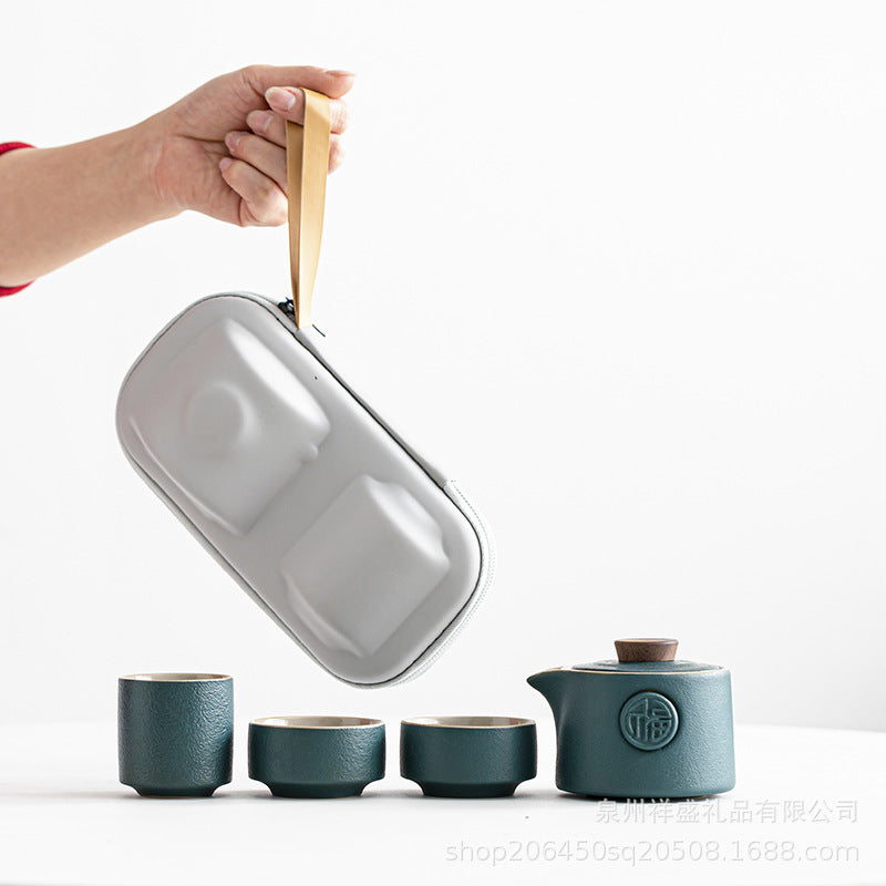 Tea set with a carrying case on a white background