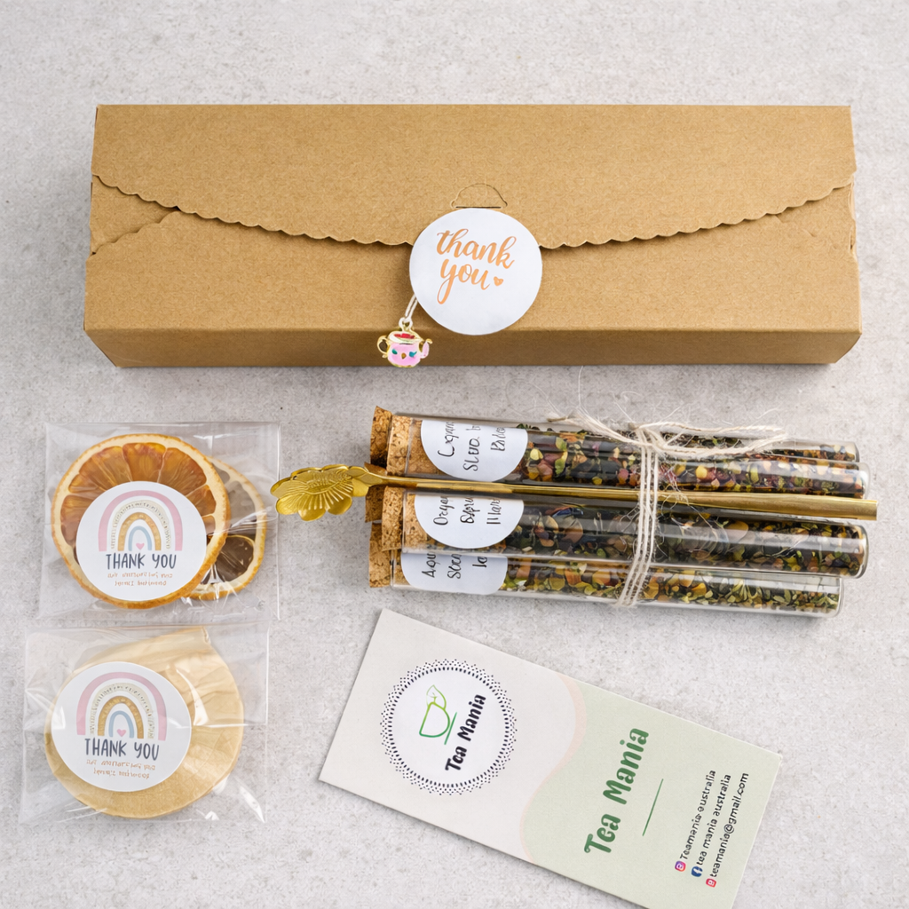 Tea packaging with 'thank you' labels and a branded card on a light gray background